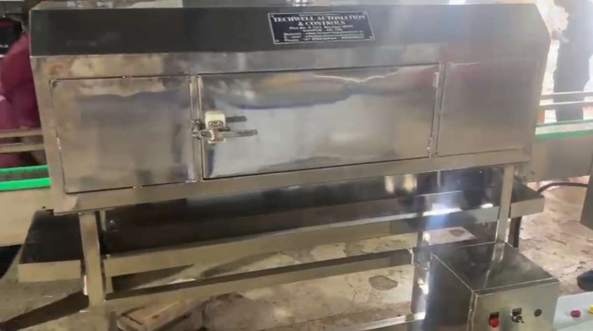 Photos of shrink conveyor from techwell automation and controll