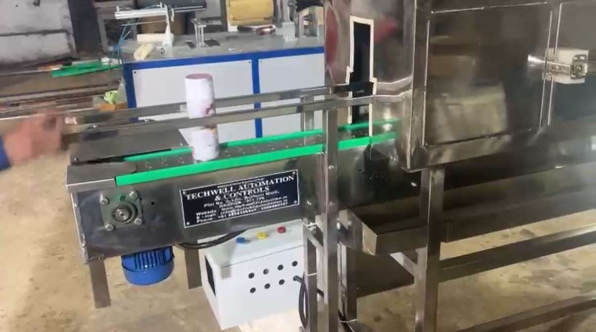 Photos of shrink conveyor from techwell automation and controll