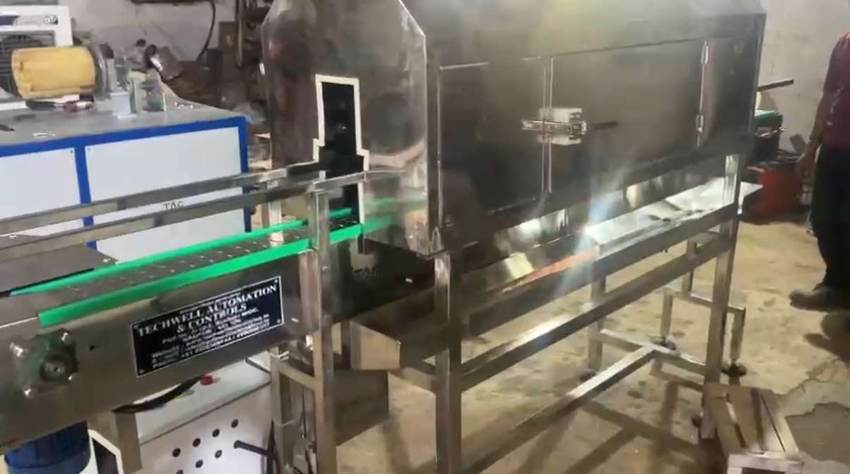 Photos of shrink conveyor from techwell automation and controll