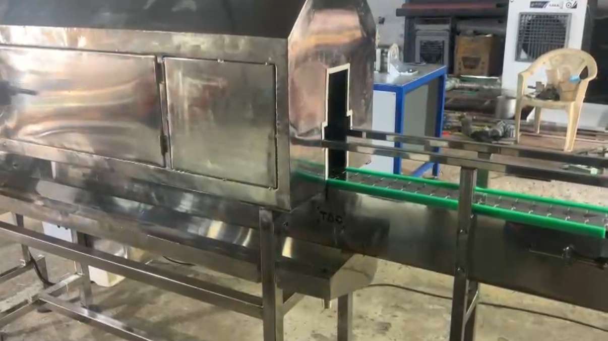 Photos of shrink conveyor from techwell automation and controll