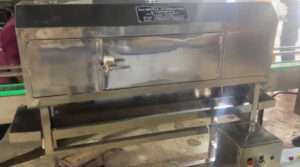 Photos of shrink conveyor from techwell automation and controll